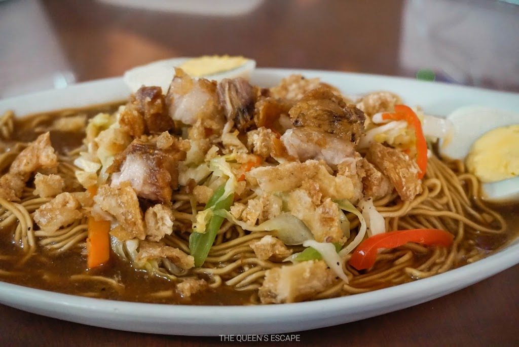 a plate of saucy fried noodles