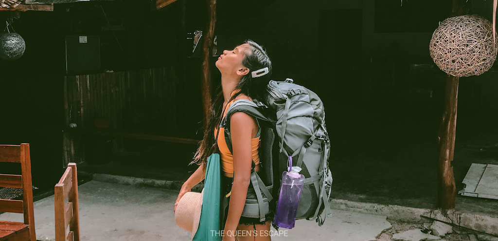 a girl with a backpack looking up