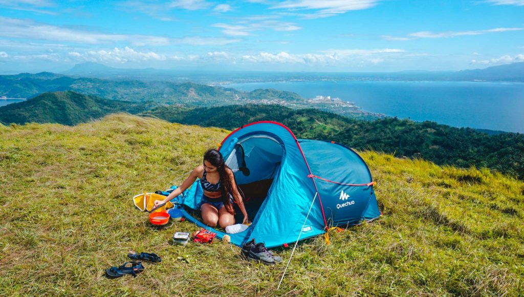 A lady in a tent at the campsite of Mt. Gulugod Baboy