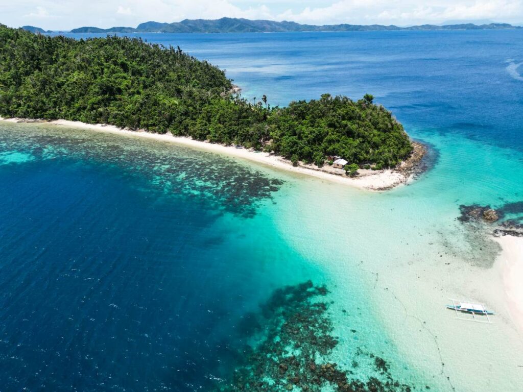 Aerial view of Maxima Island, one the places to visit when in Port Barton, San Vicente, Palawan, Philippines